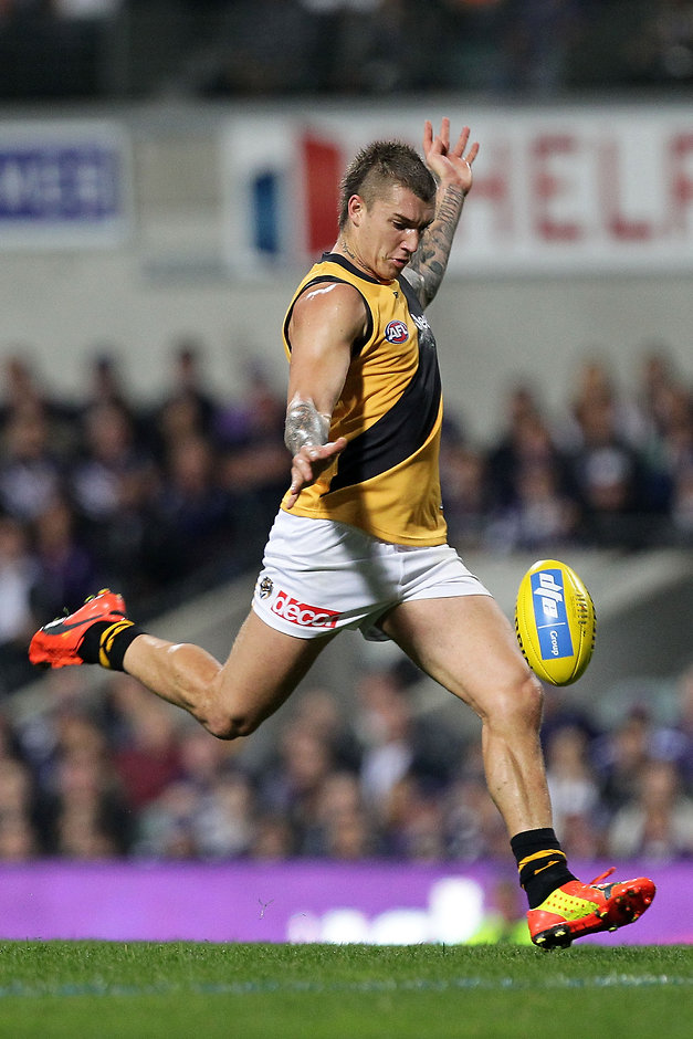 AFL 2015 Rd 10 - Fremantle v Richmond PERTH, AUSTRALIA - JUNE 05: Dustin Martin of the Tigers kicks the ball during the 2015 AFL Round 10 match between the Fremantle Dockers and the Richmond Tigers at Domain Stadium, Perth on June 5, 2015. (Photo by Will Russell/AFL Media)